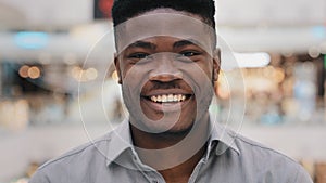 Male portrait close-up young surprised amazed african american man feeling shock surprise happy guy smiling nodding