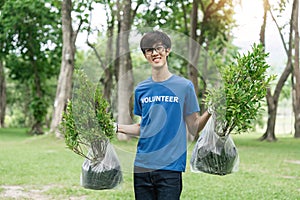 male portrait, tree and gardening in a park with trees in nature environment, agriculture or garden. Happy volunteer