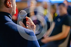 Male presenter speaks to audiences