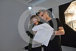 Male producer and photographer in modern studio