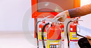 Male Professional inspection Fire extinguisher,safety concept