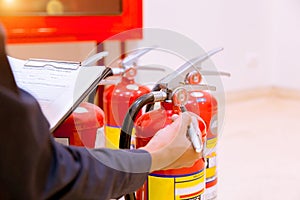 Male Professional inspection Fire extinguisher,safety concept