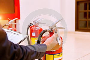 Male Professional inspection Fire extinguisher,safety concept