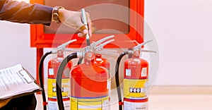 Male Professional inspection Fire extinguisher,safety concept