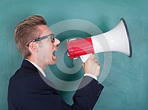 Male professor shouting though megaphone