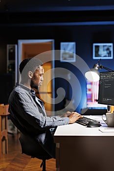 Male programmer working on developing new html script