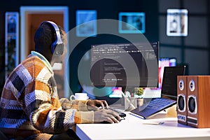 Male programmer working on developing new html script,