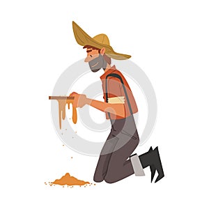 Male Prospector, Bearded Gold Miner Character Wearing Vintage Clothes and Hat Standing on his Knees and Panning Golden