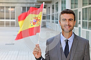 Male proudly waving the Spanish flag