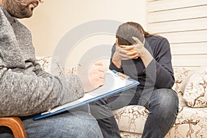 Male psychologist consulting sad depressive man at psychological therapy session, psychologist consultation and mental help