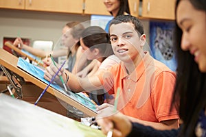 Male Pupil In High School Art Class