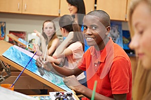 Male Pupil In High School Art Class