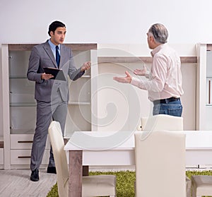 Male real estate agent and male client in the apartment