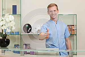 Male receptionist with okay gesture
