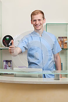 Male receptionist with okay gesture