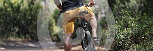 Male rents bike for ride, forest landscape, path for journey, adventure time