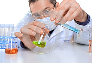 Male researcher carrying out scientific research in a lab.