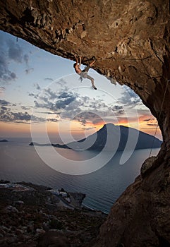 Male rock climber at sunset. Kalymnos, Greece