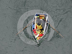 Male rowing boat top view