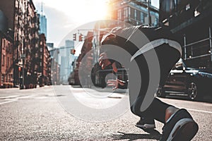 Male runner preparing to run straight through Manhattan streets