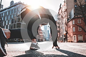 Male runner preparing to run straight through New-York streets