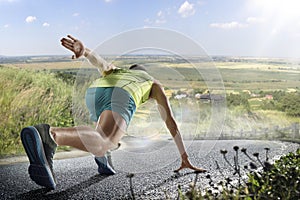 Male runner sprinting during outdoors training for marathon run