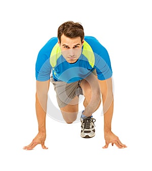 Male Runner At The Starting Block Before Race