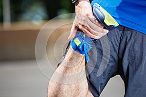Male runner stretching