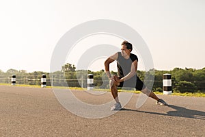 Male runners are stretching the leg muscles to prepare for a run