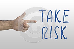 Male`s hand showing to Take Risk. Taking risk, danger chance concept.