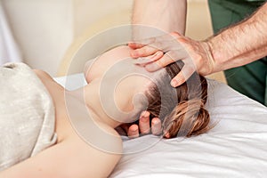 Male`s hands doing head massage