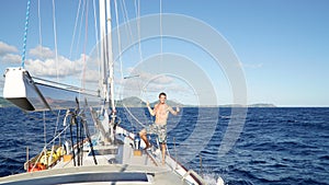 Male sailor on a yacht sail boat on the open ocean near Antigua in the Caribbean island nation Antigua and Barbuda.