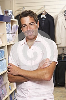 Male sales assistant in clothing store