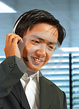 Male Sales Representative Talking On A Headset