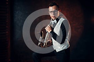 Male saxophonist playing classical jazz on sax