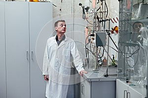 Male scientist conducts chemical experiments with fluids in medical laboratory