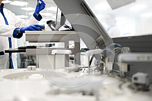 Male scientist doing biochemical blood test in laboratory