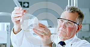 Male scientist experimenting in laboratory 4k