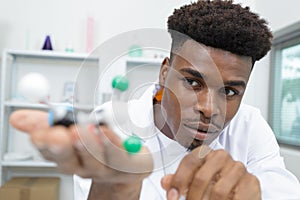 Male scientist experimenting molecule structure