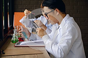 male scientist inspect chemical liquid