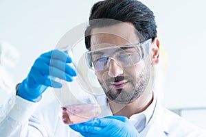 Male Scientist Looking Vaccine