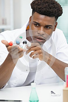 male scientist with molecules model photo