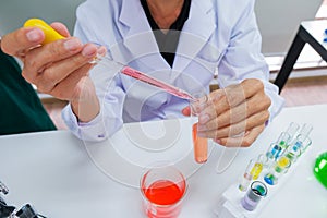 Male scientist standing with techer in lab worker making medical