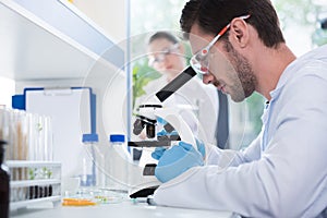 Male scientist during work at modern biological laboratory