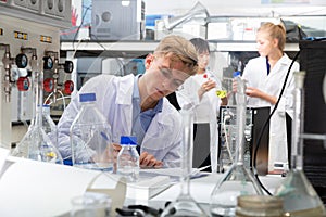 Male scientist working at biochemical laboratory