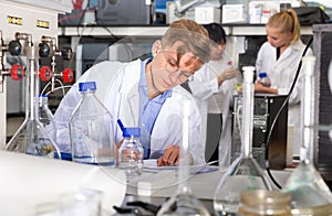 Male scientist working at biochemical laboratory