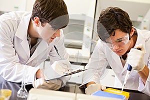 Male scientists making an experiment