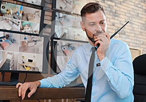 Male security guard with portable transmitter