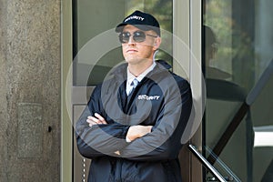 Male Security Guard Standing At The Entrance