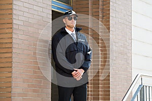 Male Security Guard Standing At The Entrance